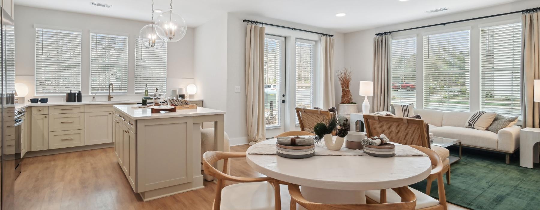 a large kitchen with a dining table