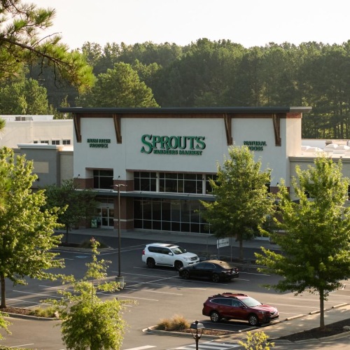 Settle into comfort at NOVEL Ballantyne a building with cars parked in front