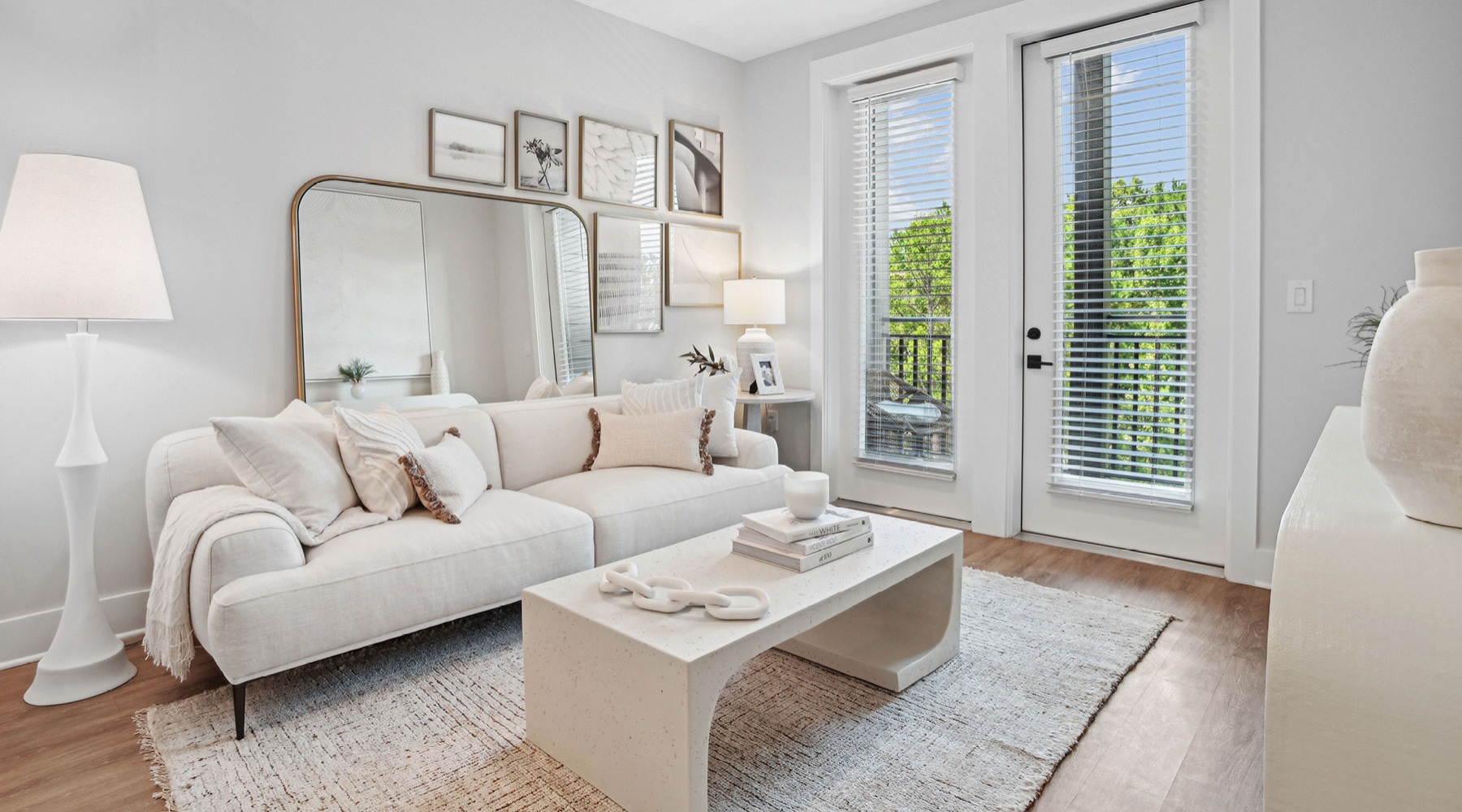 Unrivaled luxury. Unmatched convenience. a living room with a white couch and a white table