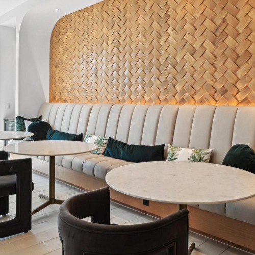 Take advantage of all NOVEL Ballantyne has to offer a seating area with small tables and a large window
