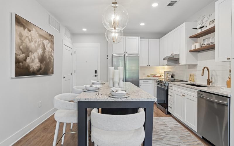 a kitchen with white cabinets